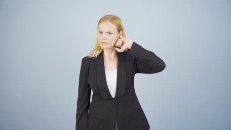business woman scratching her ear.