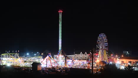 time-lapse footage. evening view of the park. ferris wheel and other forms of entertainment