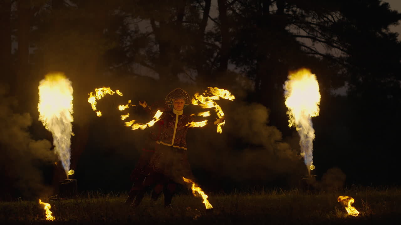 Fire Dancers in a Forest at Night