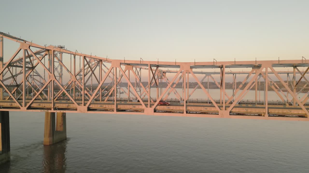 Drone view of the Natchez–Vidalia Bridge above the Mississippi river at evening light
