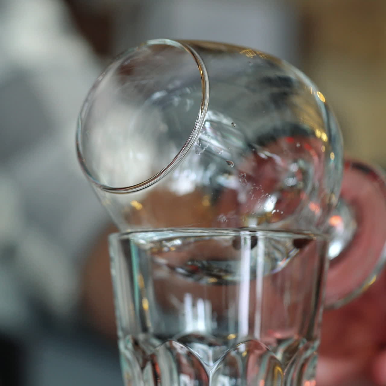 Bartender burning Sambuca at the bar. Cocktail preparation process. Sqare video