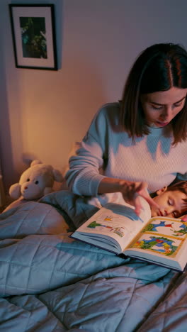 a mother and son enjoy bedtime stories together.