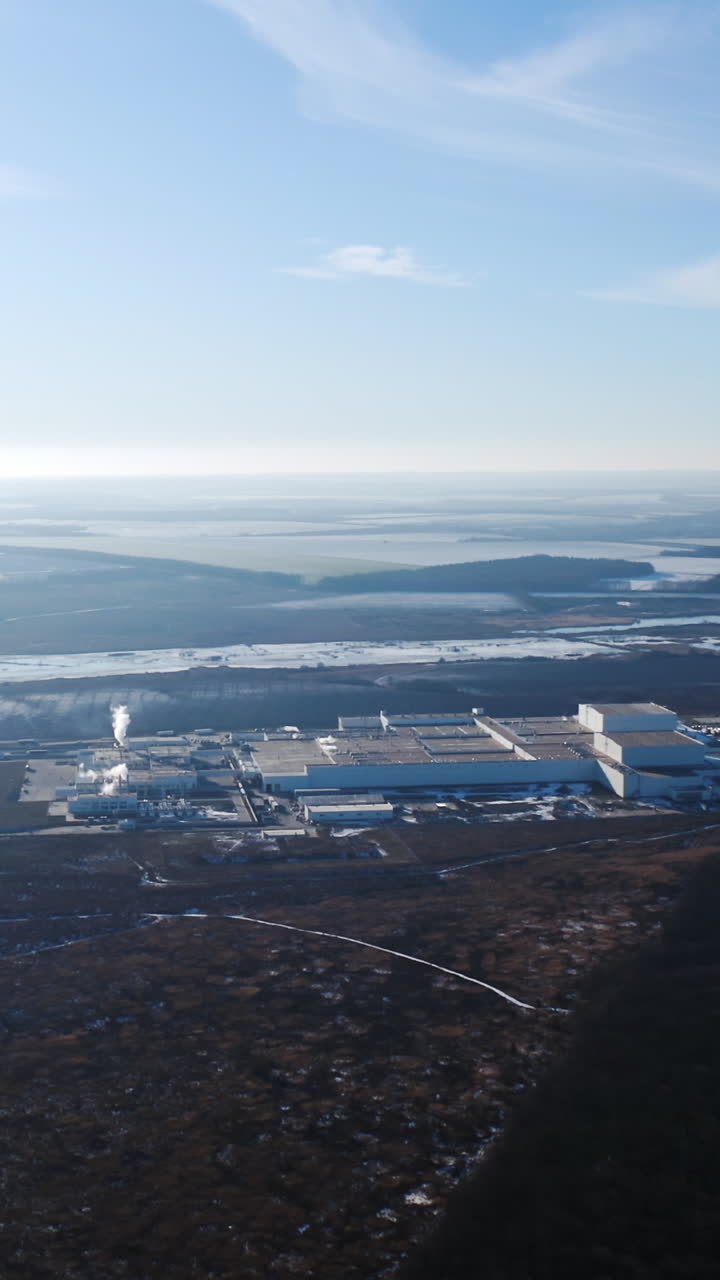 Aerial view of industrial zone. View of the urban industrial district from the air Vertical video