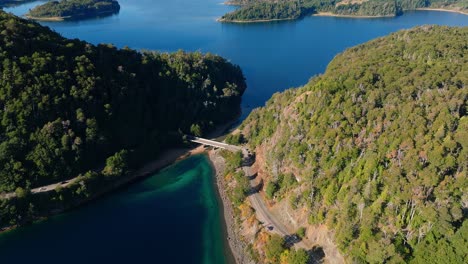 Aerial-Flying-Over-Puente-Arroyo-La-Angostura-With-Tilt-Up-Reveal-Of-Cinematic-Shot-Of-Lake-Perito-Moreno-Near-Bariloche,-Rio-Negro,-Argentina