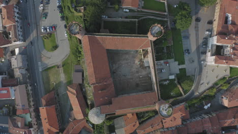 Top-down-aerial-view-of-Ivrea-Castle-in-town-square