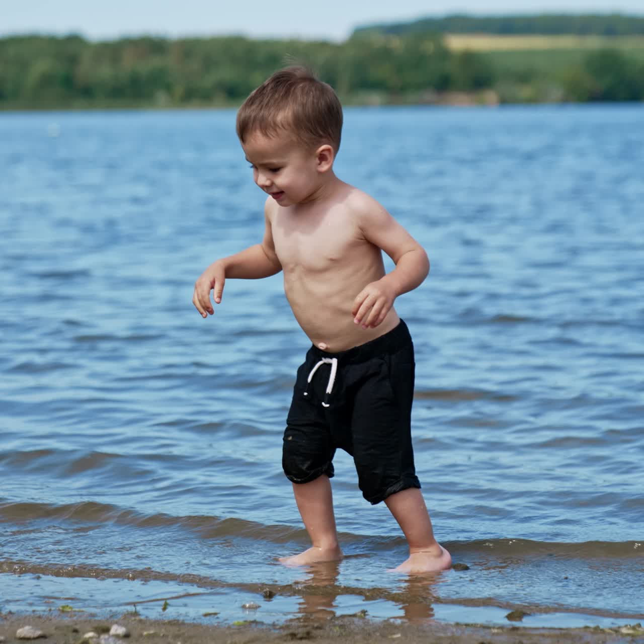 Summer child having fun on a river. Water summertime lifestyle
