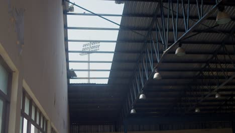 empty basketball court, forgotten and dilapidated. urban exploration.