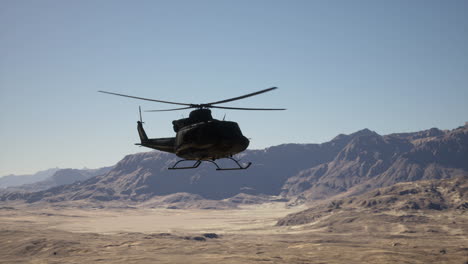 helicopter flying over desert landscape