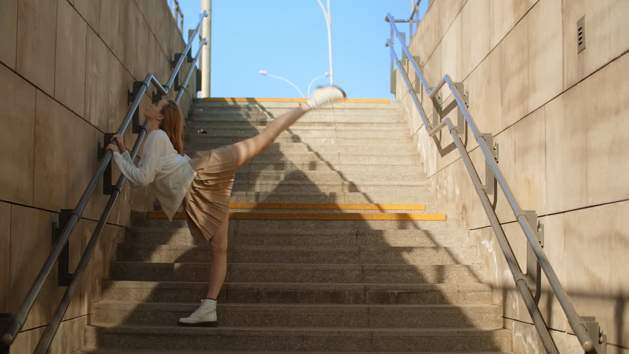 Young Woman Stretching on City Stairs