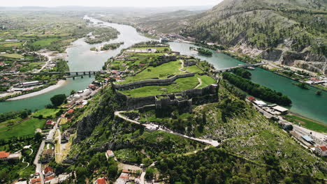 Stunning-panoramic-aerial-view-of-a-castle-in-ruins-on-a-hill