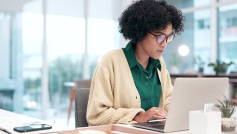 Accountant-woman,-reading-and-typing-on-laptop