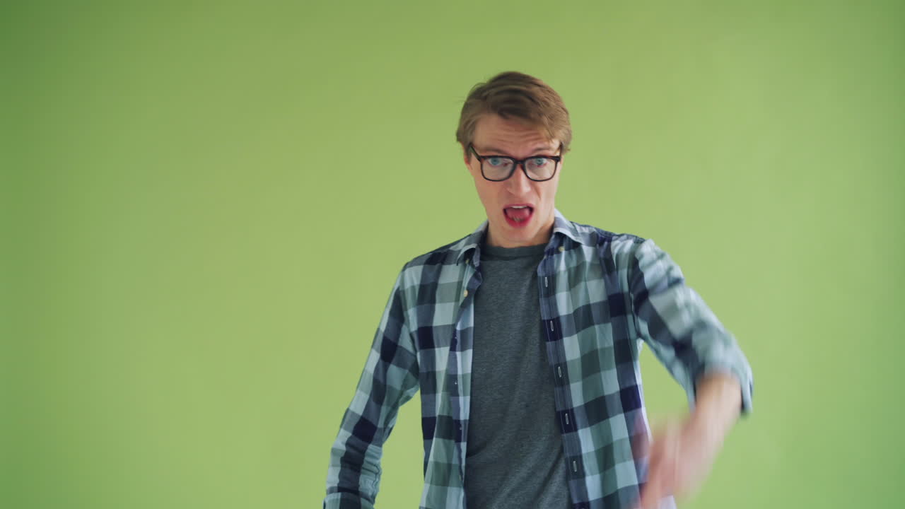 Surprised Man with Glasses in Plaid Shirt