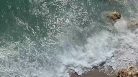 Flying-over-giant-waves-bubbling-and-splashing-in-the-ocean