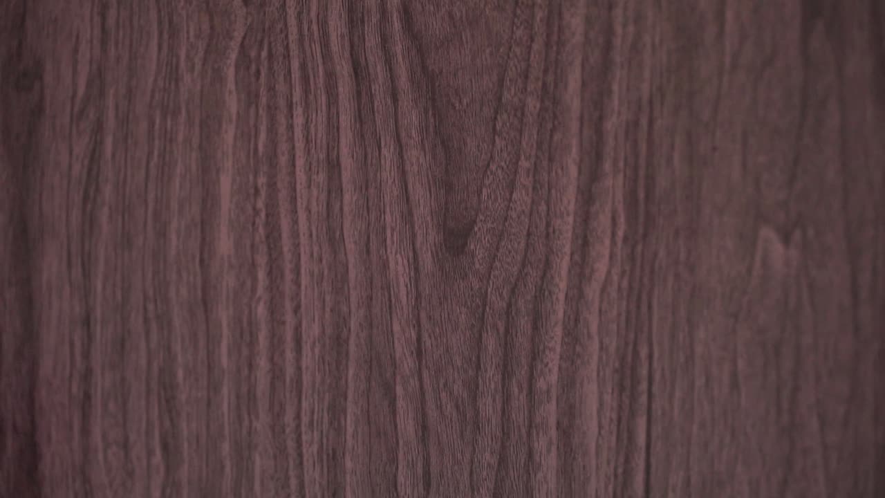 Human hand knocking on a wooden door in a close view, representing themes of visiting, approaching, or seeking permission