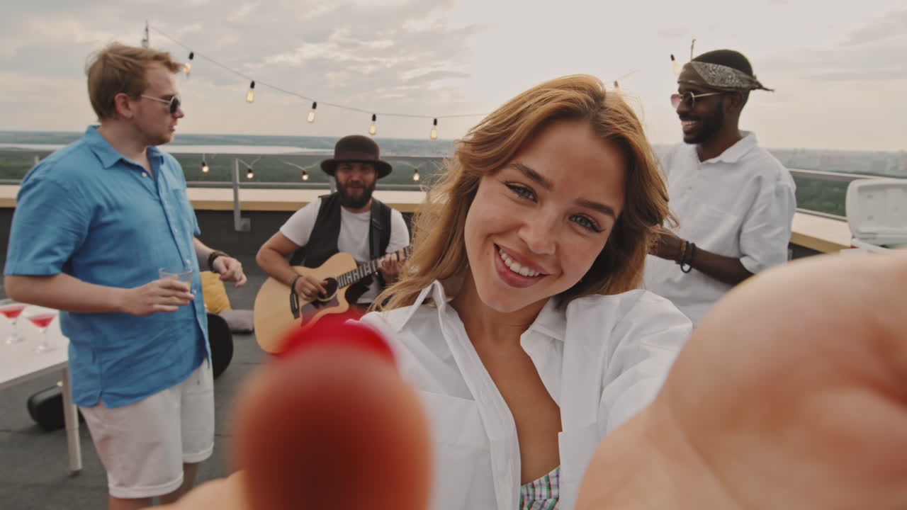 POV of Happy Woman Having Rooftop Party with Friends