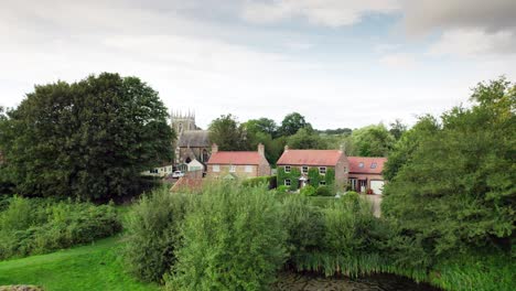 Aerial-video-footage-of-the-remains-of-Bolingbroke-Castle-a-13th-century-hexagonal-castle,-birthplace-of-the-future-King-Henry-IV,-with-adjacent-earthwork