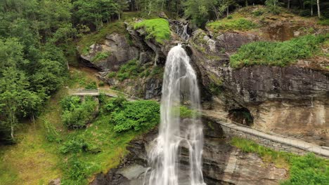 Steinsdalsfossen-is-a-waterfall-in-the-village-of-Steine-in-the-municipality-of-Kvam-in-Hordaland-county,-Norway.-The-waterfall-is-one-of-the-most-visited-tourist-sites-in-Norway.