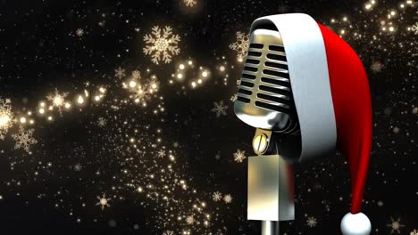 santa hat over microphone against golden shooting star against black background