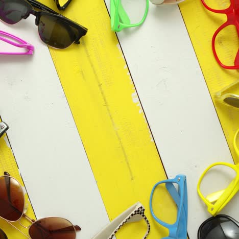 composition of various style and color sunglasses and frames captured from above