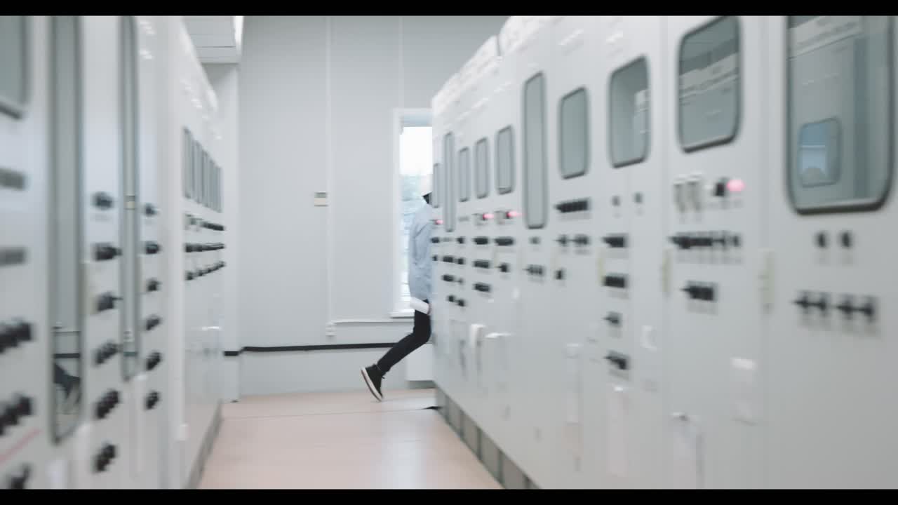 Engineer working at a power plant control panel