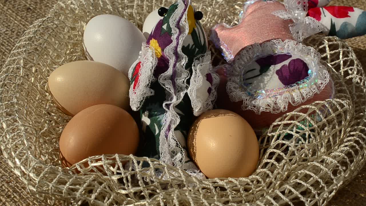 Eggs in a basket against a sacking. Easter still life