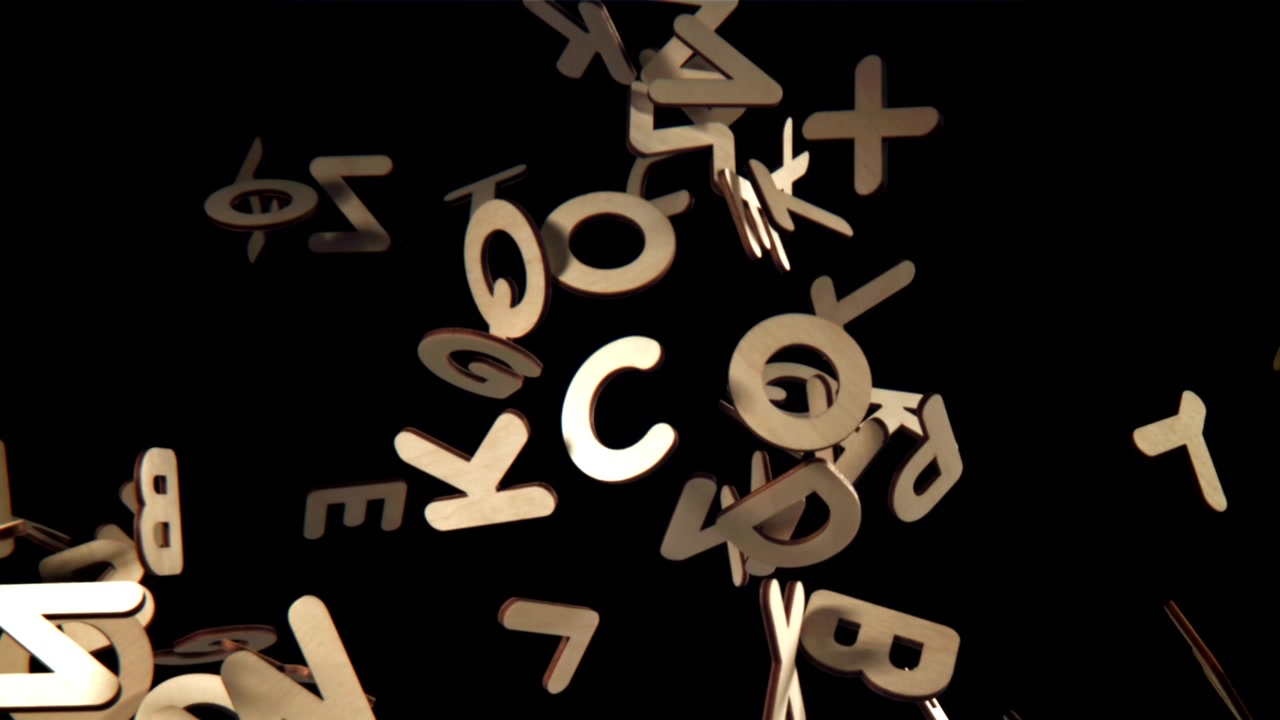 Wooden Alphabet Letters Falling and Floating on Black Background