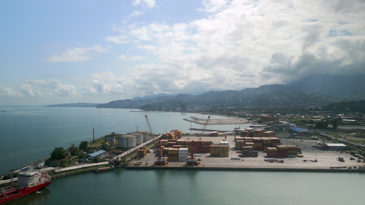 Aerial view of a seaport with cargo containers and tankers