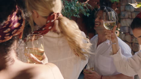 happy woman dancing with friends at summer dance party drinking wine enjoying summertime social gathering having fun celebrating on sunny day 4k footage