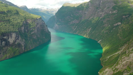 picturesque view of geiranger fjord surrounded by steep rocky mountains in norway