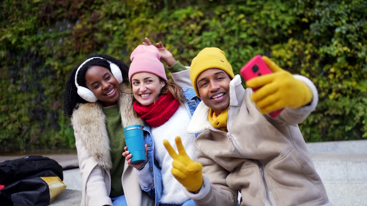 Friends Taking Selfies in Winter Clothing