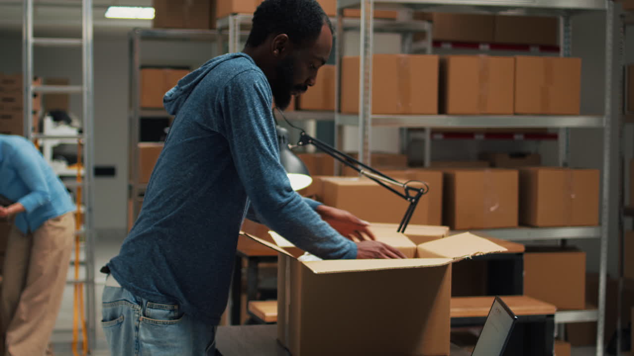Warehouse workers packaging items for shipping