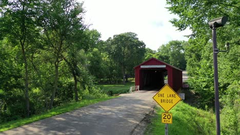 approaching small one lane wooden covered bridge, dolly forward, princeton, illinois