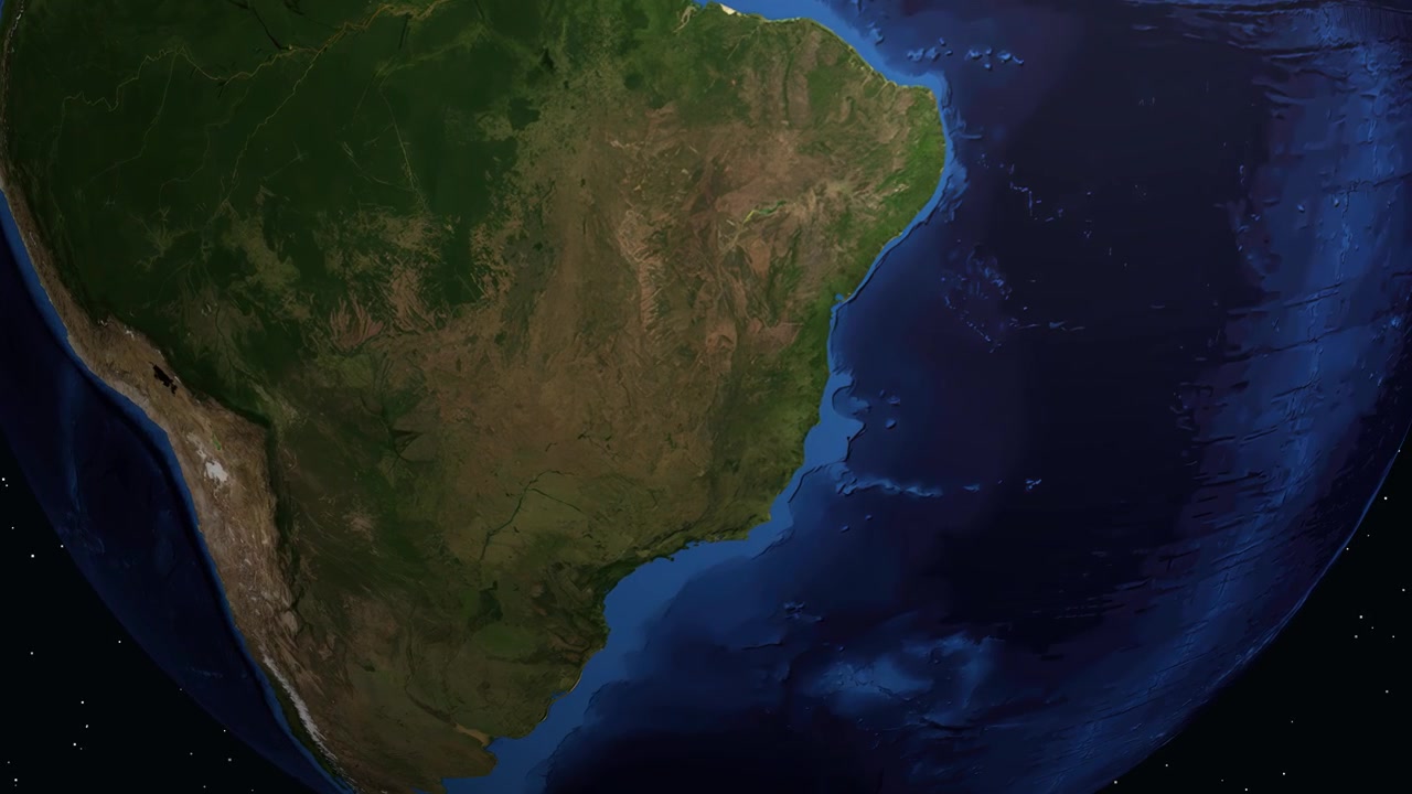 Terra digitale ruota e si ingrandisce sul Sud America, evidenziando Montes Claros con testo informativo.