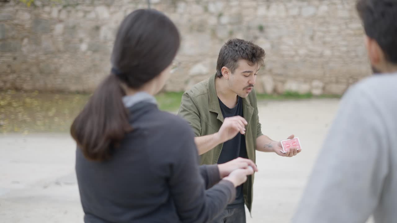 Street Magicians Performing Card Tricks