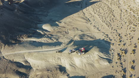 aerial pan shot of a camping site near the tufa spires in the california desert