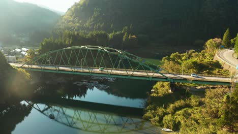 rural gifu japan, bridge over river at sunrise, aerial shot