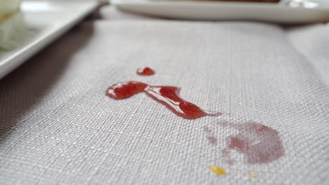 strawberry jam spill on tablecloth