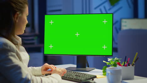 Freelancer-working-in-front-of-green-screen-display