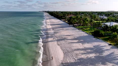 aerial push in over the beachfront in naples florida