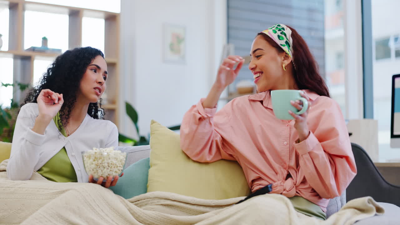 Eating popcorn, talking and happy friends watching