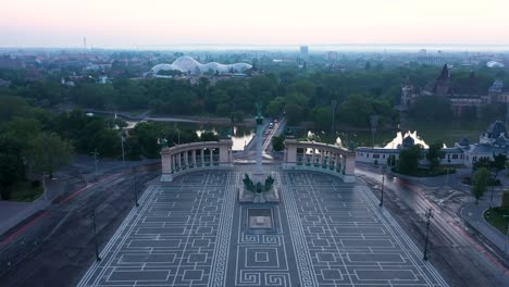 drone footage of the empty heroe's square in budapest, hungary at the time of the covid virus. early morning at the sunrise in spring.drone goes slowly forward.