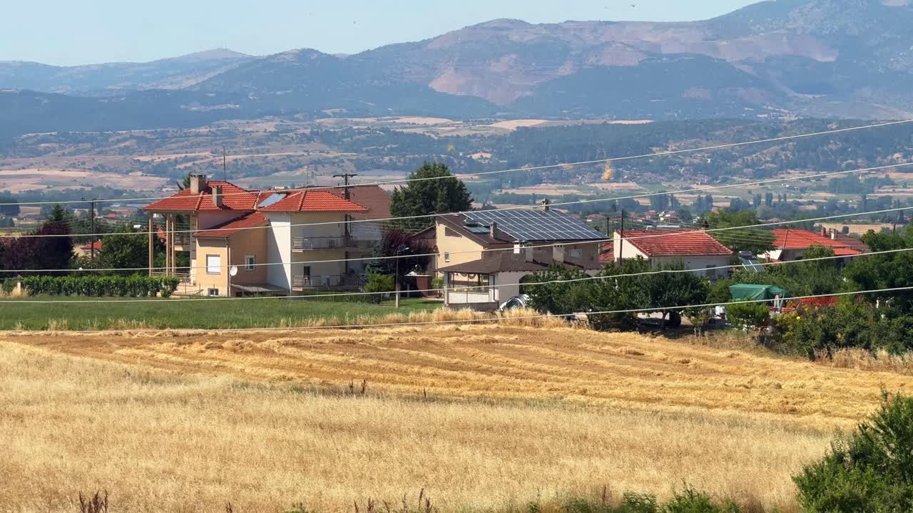 Small wind tornado dust devil Greece rural countryside village outdoor clear sky