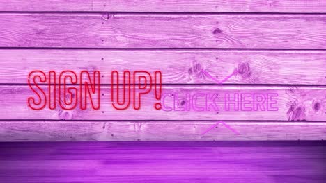 Sign-up-and-click-here-neon-text-against-purple-wooden-background