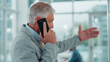 Senior Business Man on a Phone Call in an Office