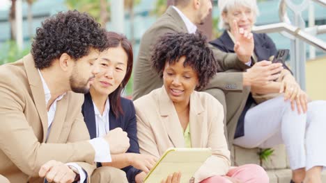 diverse business team using tablet