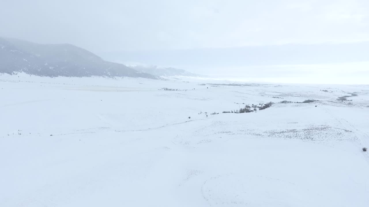 AERIAL - Beautiful sky during a snow covered winter