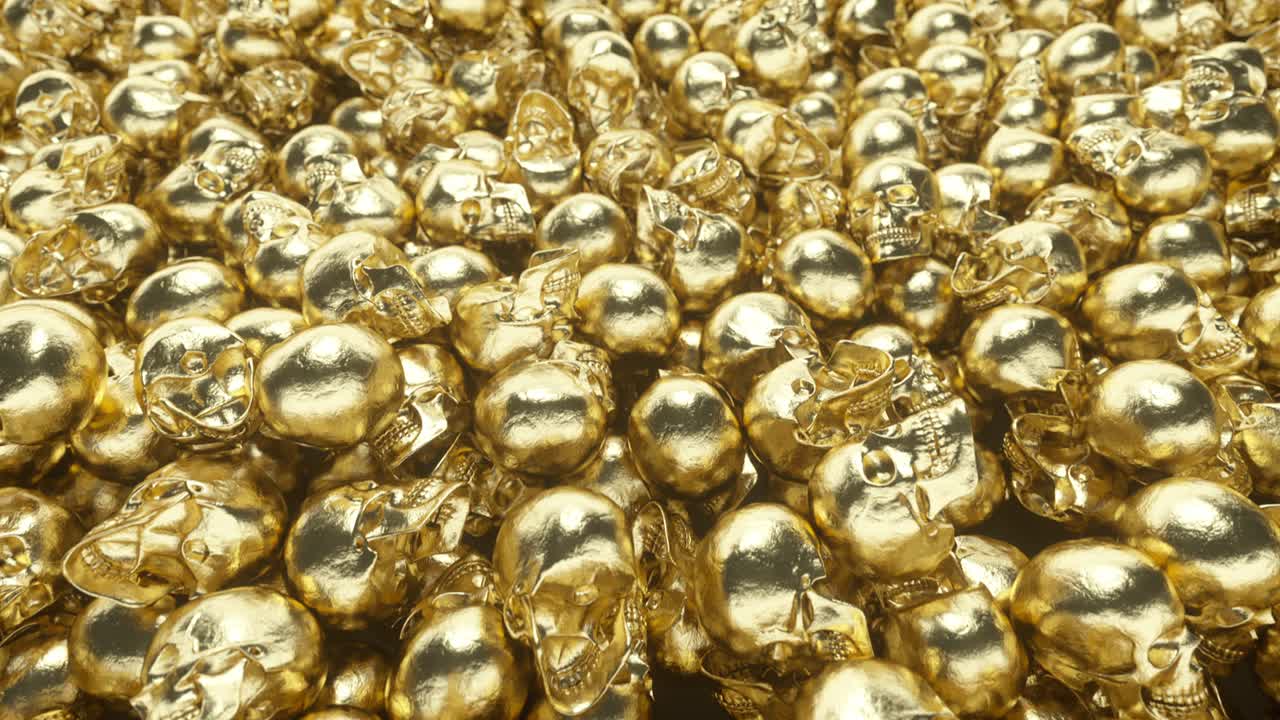 한 무리의 황금 두개골이 서로 위에 놓여 있습니다.