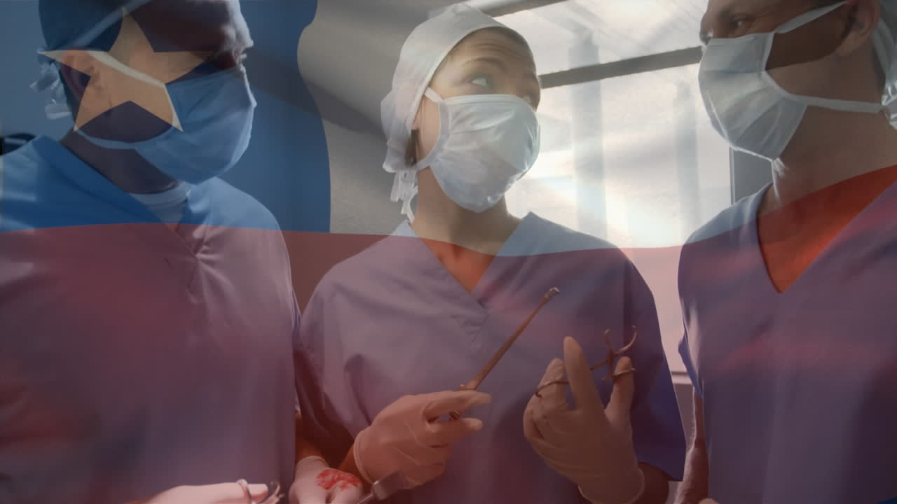 Animation of waving texas flag against team of diverse surgeons discussing together at hospital