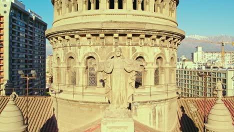 ascending flyover of the statue of jesus christ with open arms in the sacramentinos church, santiago, chile