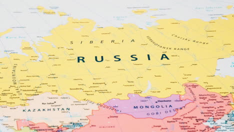 close-up of the country word russia on a world map with the detailed name of the capital city